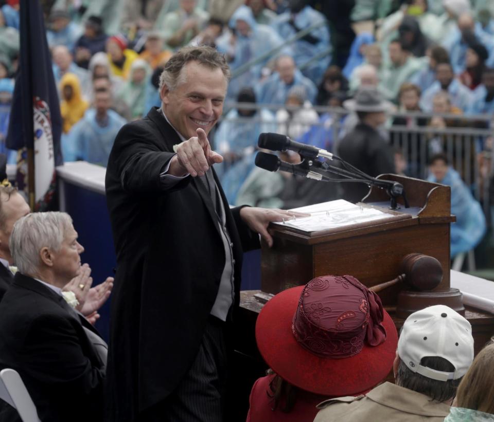 Virginia Governor Terry McAuliffe points to a member of the crowd as he delivers his inaugural address on the steps of the South Portico of the Capitol in Richmond, Va., Saturday, Jan. 11, 2014. McAuliffe was sworn in Saturday as the 72nd governor of Virginia. (AP Photo/Steve Helber)