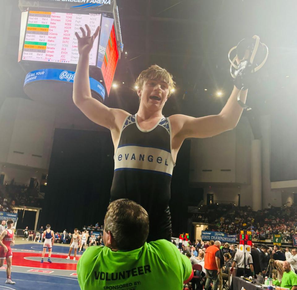 Evangel's Joseph Gilreath celebrates winning an LHSAA state wrestling title Saturday in the Brookshire Arena.