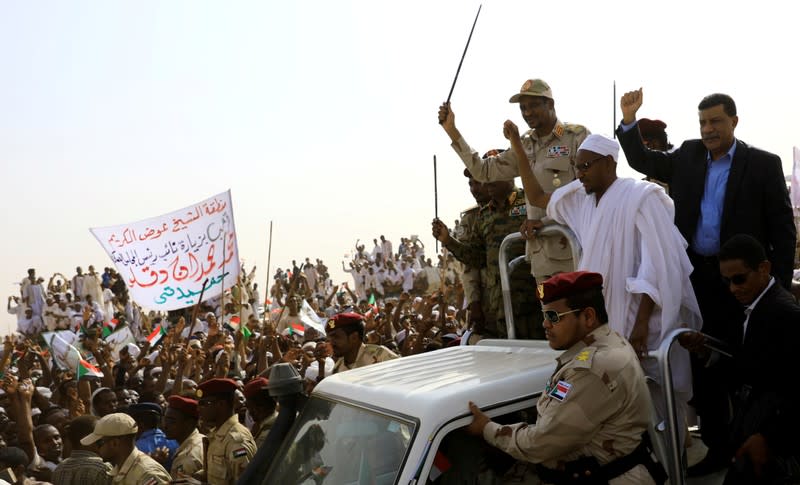 FILE PHOTO: Lieutenant General Mohamed Hamdan Dagalo greets his supporters as he arrives at a meeting in Aprag village