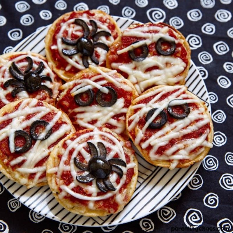 <p>Parenting Chaos</p><p>A great way to avoid sweets and fill up on some heartier snacks, these easy Halloween spider mini pizzas will do the trick. Bagel crisps help create fun spider and mummy pizzas for Halloween. </p><p><strong>Get the recipe here: <a href="https://parentingchaos.com/easy-halloween-pizza/" rel="nofollow noopener" target="_blank" data-ylk="slk:Easy Halloween Spider Pizza;elm:context_link;itc:0;sec:content-canvas" class="link rapid-noclick-resp">Easy Halloween Spider Pizza</a></strong></p>