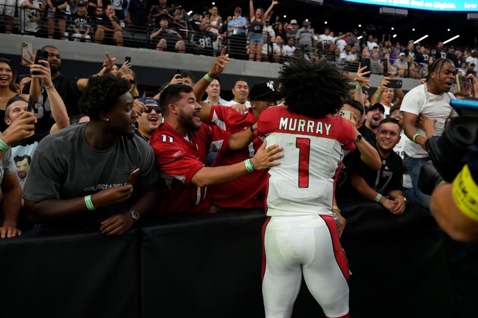 Arizona Cardinals quarterback Kyler Murray (1) celebrates with fans after an overtime win over the Las Vegas Raiders during an NFL football game Sunday, Sept. 18, 2022, in Las Vegas.