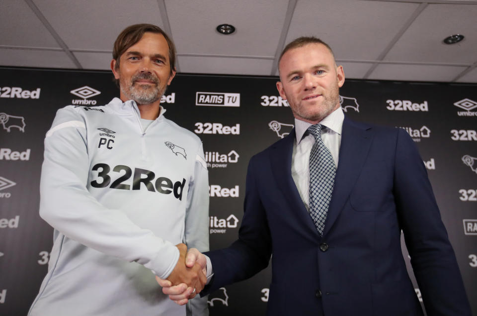 Soccer Football - Championship - Derby County - Wayne Rooney Press Conference - Pride Park, Derby, Britain - August 6, 2019   Derby County manager Phillip Cocu and Wayne Rooney pose during the press conference   Action Images via Reuters/Carl Recine