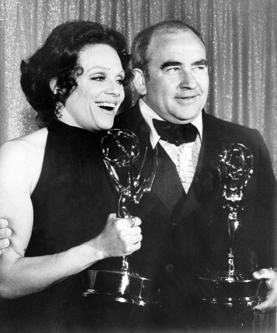 FILE - In this May 9, 1971 file photo, Actress Valerie Harper, left, and actor Ed Asner pose with their Emmy statuettes at the annual Primetime Emmy Awards presentation in Los Angeles, Calif. Valerie Harper, who scored guffaws and stole hearts as Rhoda Morgenstern on back-to-back hit sitcoms in the 1970s, has died, Friday, Aug. 30, 2019. She was 80. (AP Photo/File)