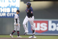 Minnesota Twins' Gio Urshela runs past second base after hitting a home run during the fourth inning of the team's baseball game against the Cleveland Guardians, Saturday, May 14, 2022, in Minneapolis. (AP Photo/Stacy Bengs)