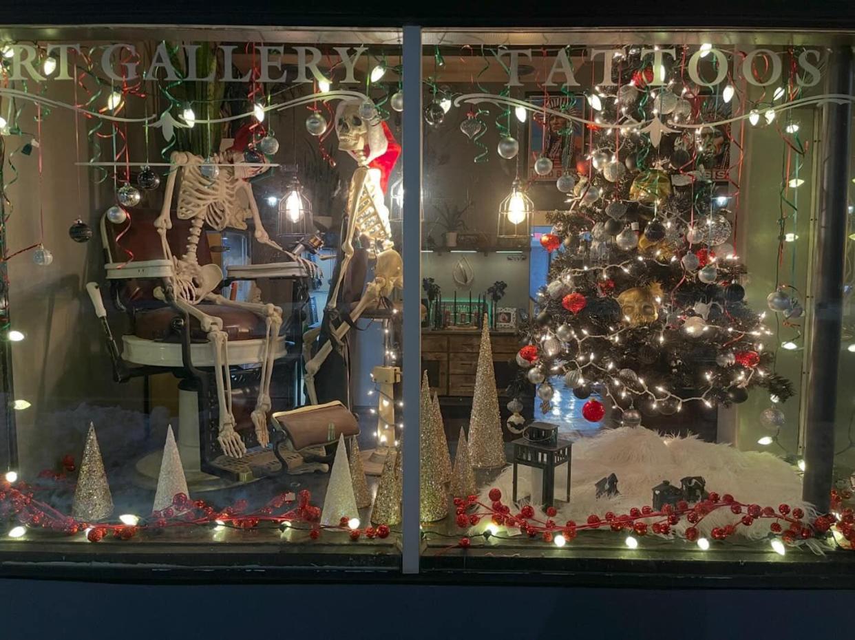 Solomon's Tattoo Parlor was one of two winners of this year's downtown Christmas decorating contest with its Christmas skeleton theme.
