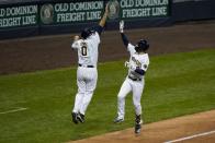 Milwaukee Brewers' Ryan Braun celebrates his three-run home run with third base coach Ed Sedar during the eighth inning of a baseball game against the Kansas City Royals Saturday, Sept. 19, 2020, in Milwaukee. (AP Photo/Morry Gash)