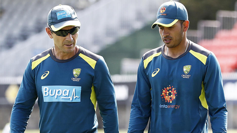 Australian cricket coach Justin Langer is pictured in conversation with Usman Khawaja.