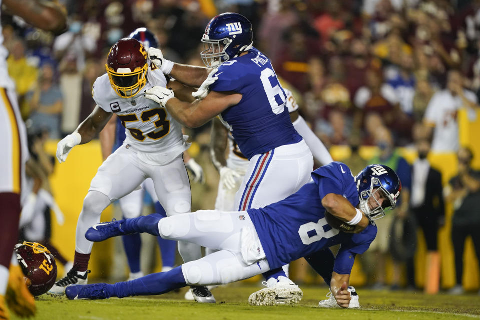 New York Giants quarterback Daniel Jones (8) scores a touchdown against the Washington Football Team during the first half of an NFL football game, Thursday, Sept. 16, 2021, in Landover, Md. (AP Photo/Al Drago)