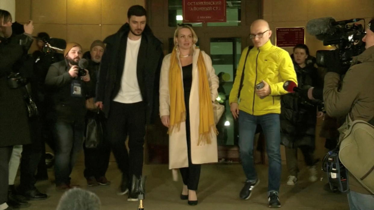 Marina Ovsyannikova, a Channel One employee who staged an on-air protest as she held up a anti-war sign behind a studio presenter, leaves the court building in Moscow, Russia March 15, 2022 in this still image taken from a video. REUTERS TV via REUTERS