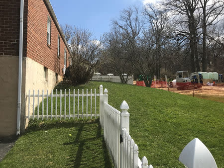 Construction takes place after sinkholes appeared in the backyards of houses in a cul-de-sac outside of Philadelphia, Pennsylvania April 5, 2018. REUTERS/Stephanie Kelly/Files