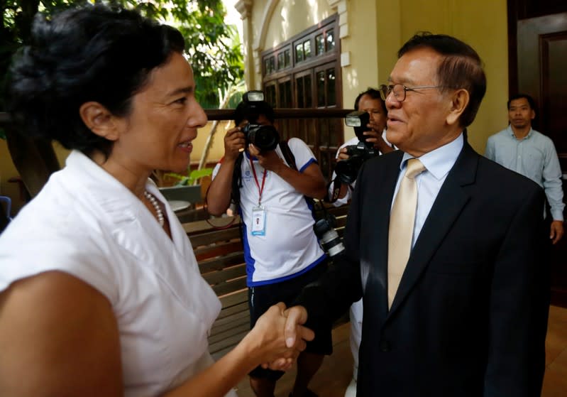 Leader of the CNRP Kem Sokha shakes hands with French Ambassador to Cambodia Eva Nguyen Binhin at his home in Phnom Penh