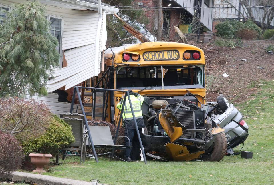 A school bus ran off of Southgate Dr. In New Hempstead, hitting a parked minivan and crashed into a house Dec. 1, 2022. Several people including children were taken to hospitals.