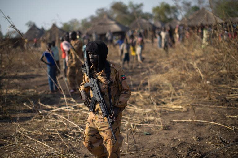 A South Sudanese policeman in the outskirts of Mvolo, 75 miles from Rumbek in the Western Equatoria State, on January 14, 2014