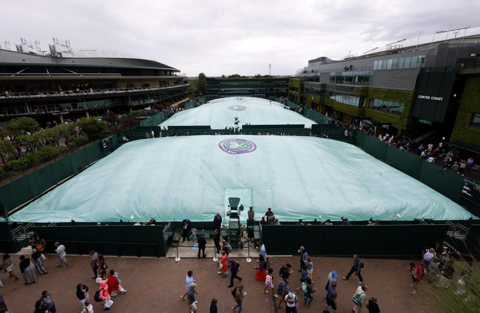 Rain stops play, as the outside courts are covered, on day one of the 2023 Wimbledon Championships at the All England Lawn Tennis and Croquet Club in Wimbledon. Picture date: Monday July 3, 2023. (Photo by Steven Paston/PA Images via Getty Images)