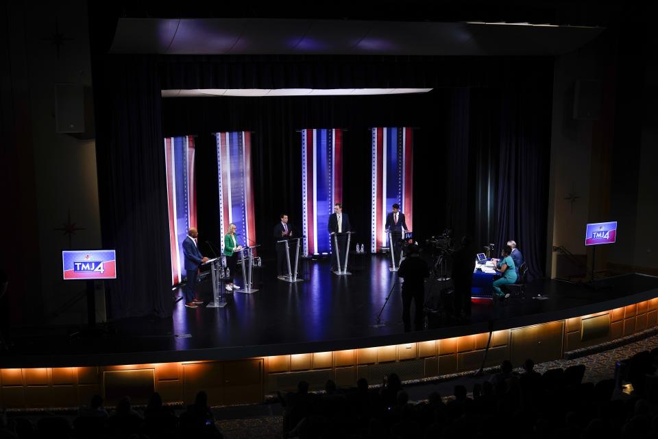 Mandela Barnes, left to right, Sarah Godlewski, Alex Lasry, Tom Nelson and Steven Olikara participate in a televised Wisconsin Democratic U.S. Senate debate, Sunday, July 17, 2022, in Milwaukee. (AP Photo/Morry Gash)