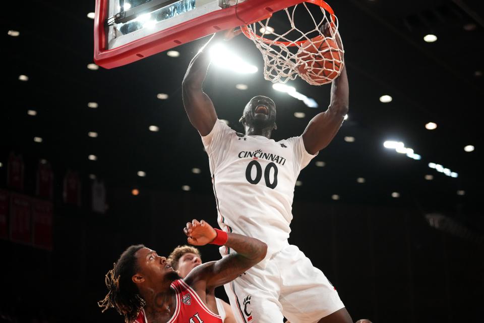 Cincinnati Bearcats forward Abdul Ado (00) puts down a put-back dunk in the second half of an NCAA men's college basketball game against the Miami (Oh) Redhawks, Wednesday, Dec. 1, 2021, at Millett Hall in Oxford, Ohio. The Cincinnati Bearcats won, 59-58.