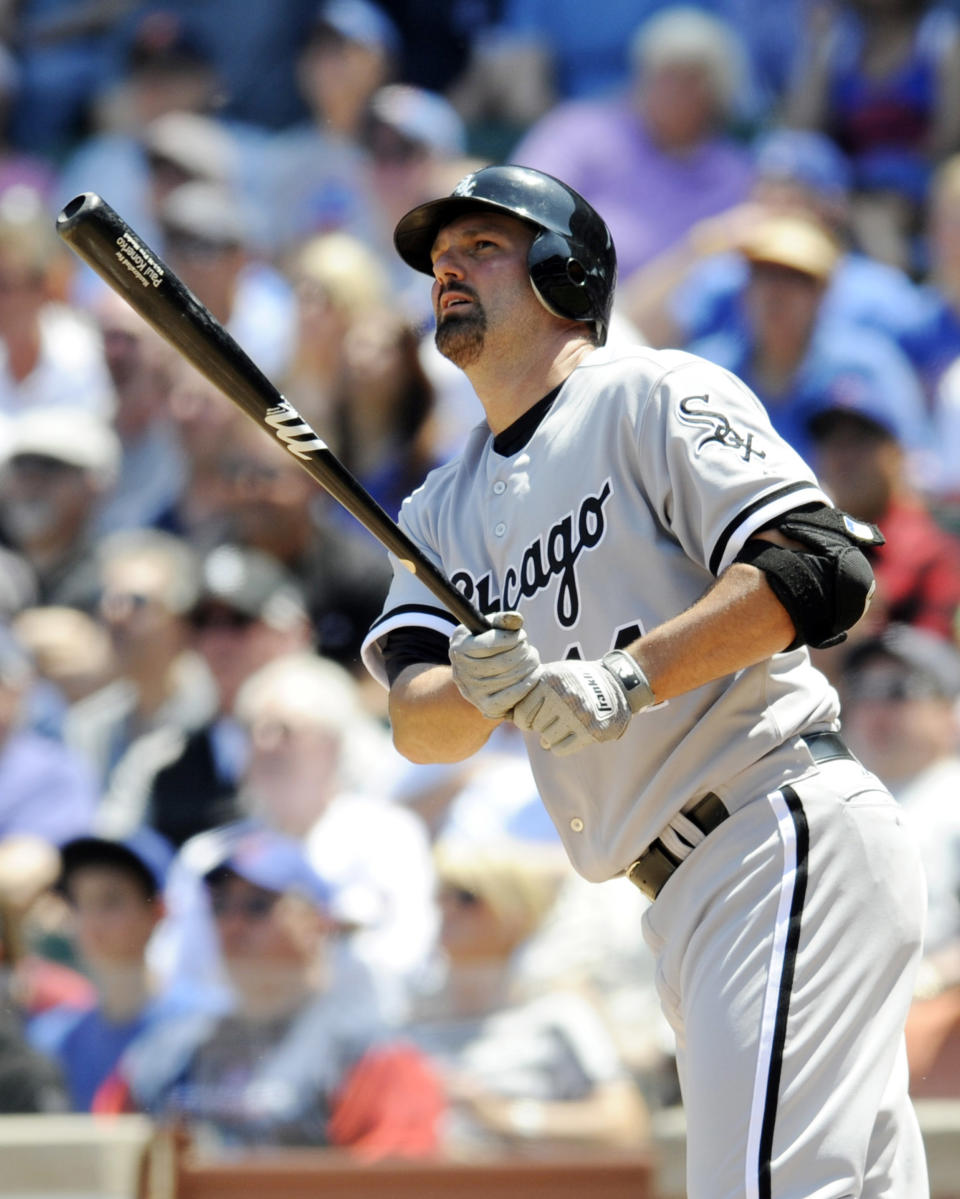 CHICAGO, IL - MAY 18: Paul Konerko #14 of the Chicago White Sox hits a two run homer in the first inning against the Chicago Cubs on May 18 2012 at Wrigley Field in Chicago, Illinois. (Photo by David Banks/Getty Images)