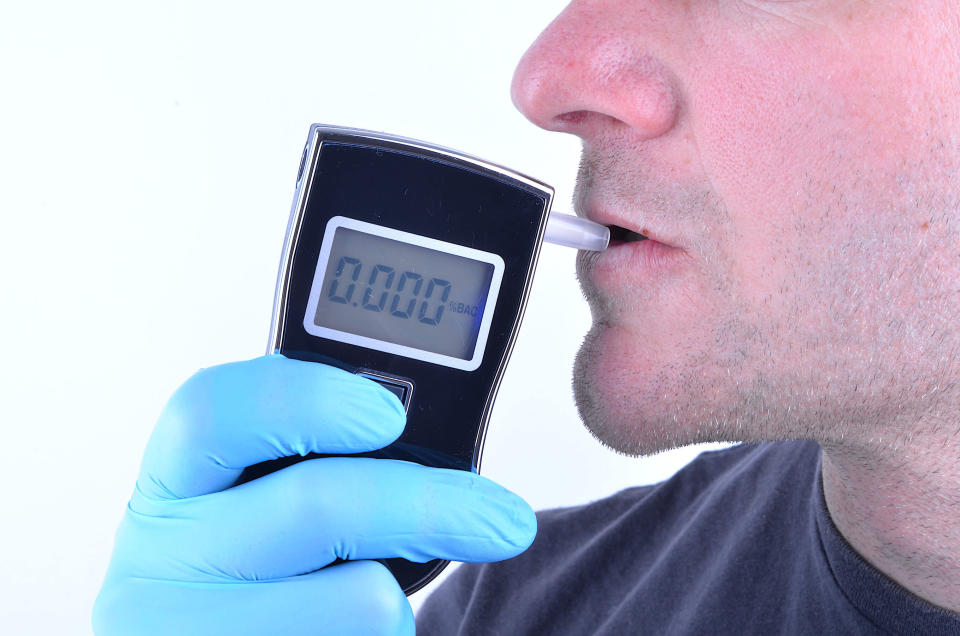 A driver takes a breathalyzer test