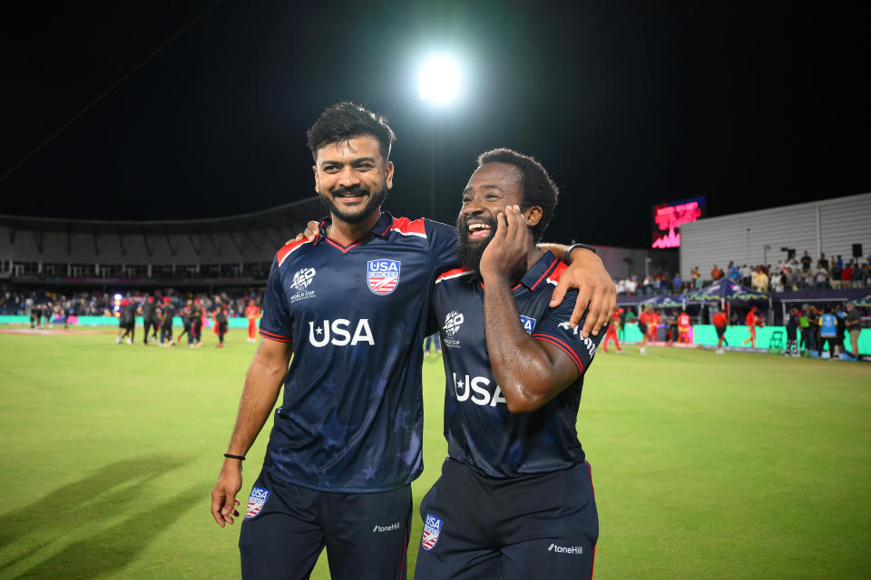 DALLAS, TEXAS - JUNE 01: Aaron Jones of USA celebrates with his teammate Monank Patel after winning the ICC West Indies and USA Men's T20 Cricket World Cup 2024 match between USA and Canada at Grand Prairie Cricket Stadium in June 1, 2024 in Dallas, Texas.  (Photo by Matt Roberts-ICC/ICC via Getty Images)