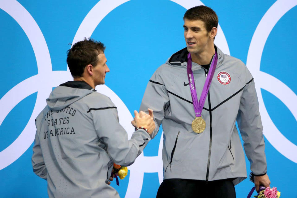 <p>Gold medallist Michael Phelps shakes hands with silver medallist Ryan Lochte during the medal ceremony for the 200-meter individual medley final at the London 2012 Olympic Games on August 2, 2012. (Ezra Shaw/Getty Images)</p>