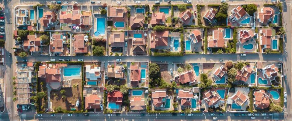 Drone Aerial Above Houses With Pools