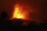 FILE - In this Monday Sept. 20, 2021 file photo, lava erupts from a volcano near El Paso on the island of La Palma in the Canaries, Spain. A long-dormant volcano on a small Spanish island in the Atlantic Ocean erupted on Sunday Sept. 19, 2021, forcing the evacuation of thousands of people. Huge plumes of black-and-white smoke shot out from a volcanic ridge where scientists had been monitoring the accumulation of molten lava below the surface. (Europa Press via AP, File)