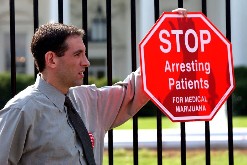 Steve Fox, a medical marijuana supporter, demonstrates in front of the White House on October 7, 2002. On October 19, 2009, the U.S. government announced it would no longer prosecute people who use or sell marijuana for medicinal purposes if they are complying with state laws. File Photo by Roger L. Wollenberg/UPI