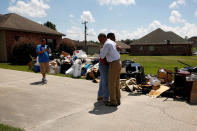 <p>President Barack Obama greets a homeowner as he tours a flood-affected neighborhood in Zachary, La., Aug. 23, 2016. (Photo: Jonathan Ernst/Reuters) </p>