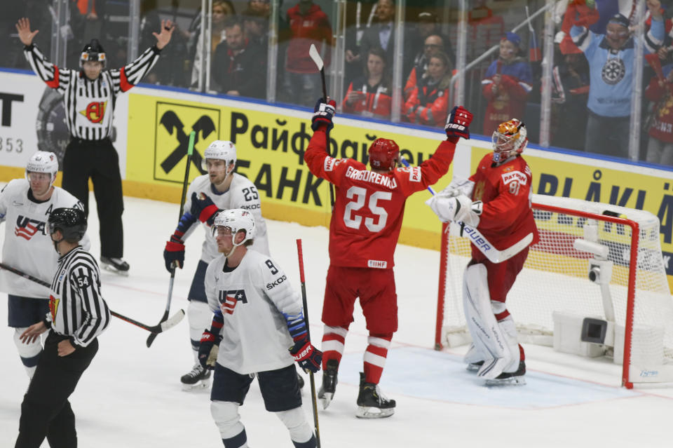 Russian players celebrate at the end of the Ice Hockey World Championships quarterfinal match between Russia and the United States at the Steel Arena in Bratislava, Slovakia, Thursday, May 23, 2019. (AP Photo/Ronald Zak)