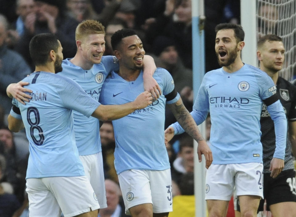 Left to right, Manchester City's Ilkay Gundogan, Kevin De Bruyne, Gabriel Jesus and Manchester City's Bernardo Silva celebrate after scoring their side's opening goal during the FA Cup 4th round soccer match between Manchester City and Burnley at Etihad stadium in Manchester, England, Saturday, Jan. 26, 2019. (AP Photo/Rui Vieira)