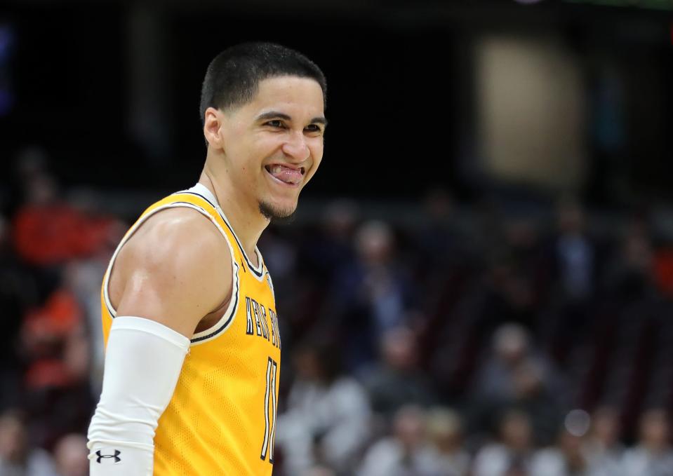 Kent State guard Giovanni Santiago (11) celebrates after the Golden Flashes upset top seed Toledo in the quarterfinals of the Mid-American Conference Tournament on Thursday.