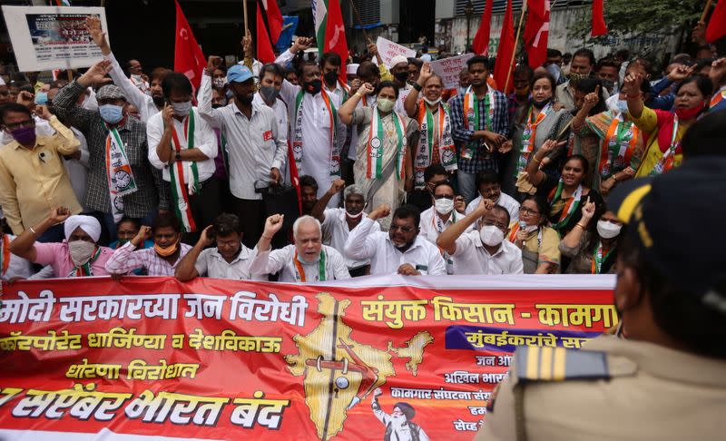 Members of the Communist Party of India (CPI) protest against farm laws during a nationwide strike, in Mumbai