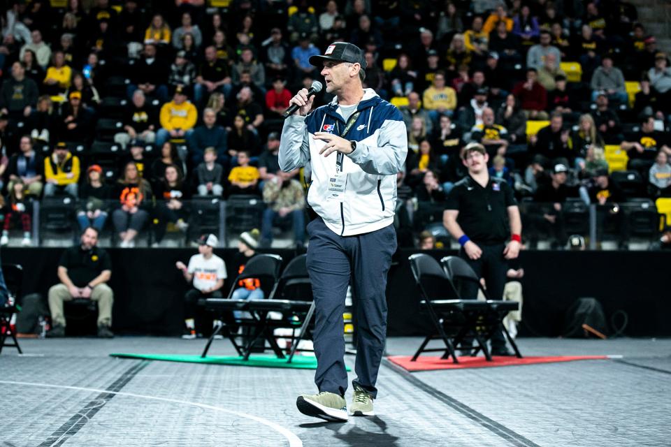 Josh Schamberger, president of Think Iowa City, speaks during the Soldier Salute college wrestling tournament Dec. 30, 2022, at Xtream Arena in Coralville.