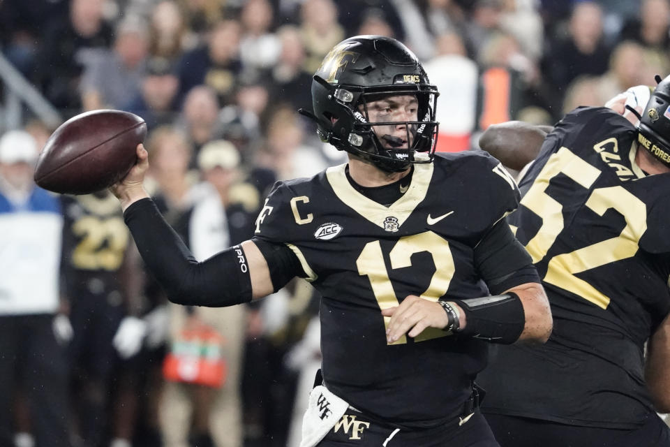 Wake Forest quarterback Mitch Griffis (12) looks to pass the ball against Georgia Tech during the first half of an NCAA college football game in Winston-Salem, N.C., Saturday, Sept. 23, 2023. (AP Photo/Chuck Burton)