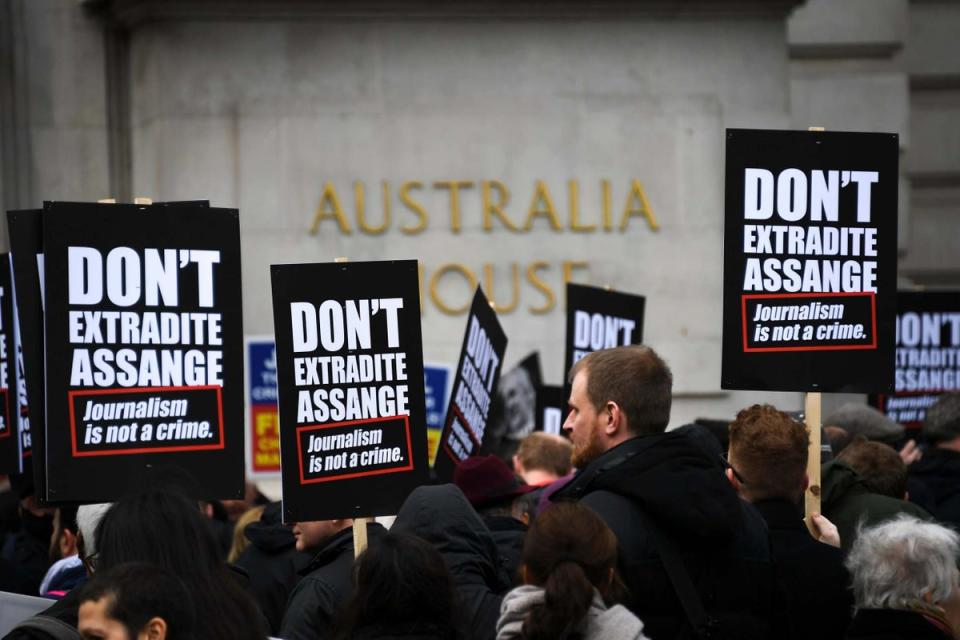 Supporters rally outside a hearing  (Alberto Pezzali / AP)