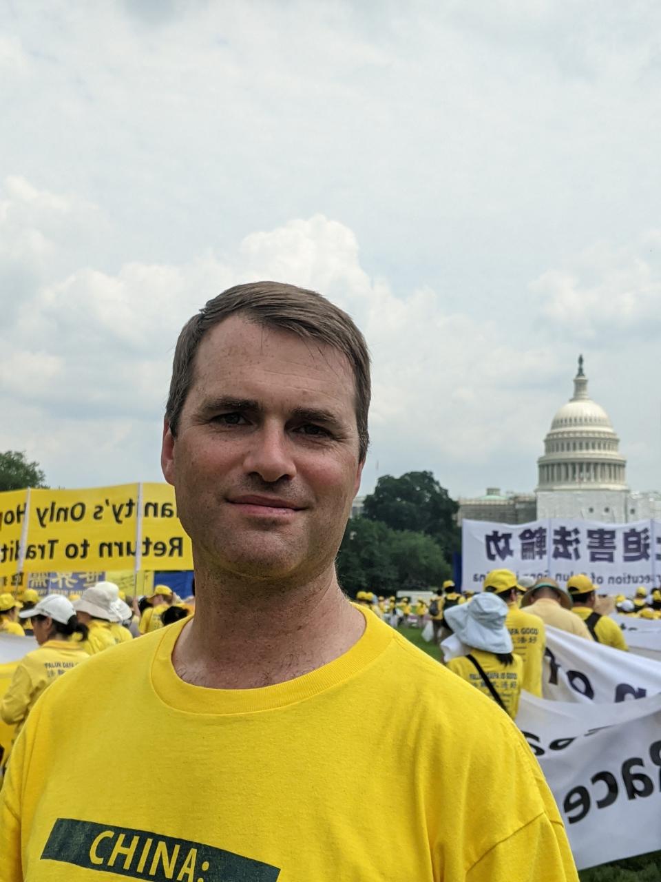 Pascack Valley and Hills Chinese teacher Liam O'Neill marching in Washington, D.C. to end the 24-year-long persecution of the spiritual practice Falun Gong in China.