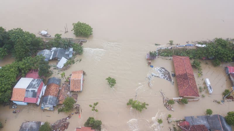 An aerial view shows a residential area affected by floods, which damaged the embankment of the Citarum river following the heavy rains, in Bekasi