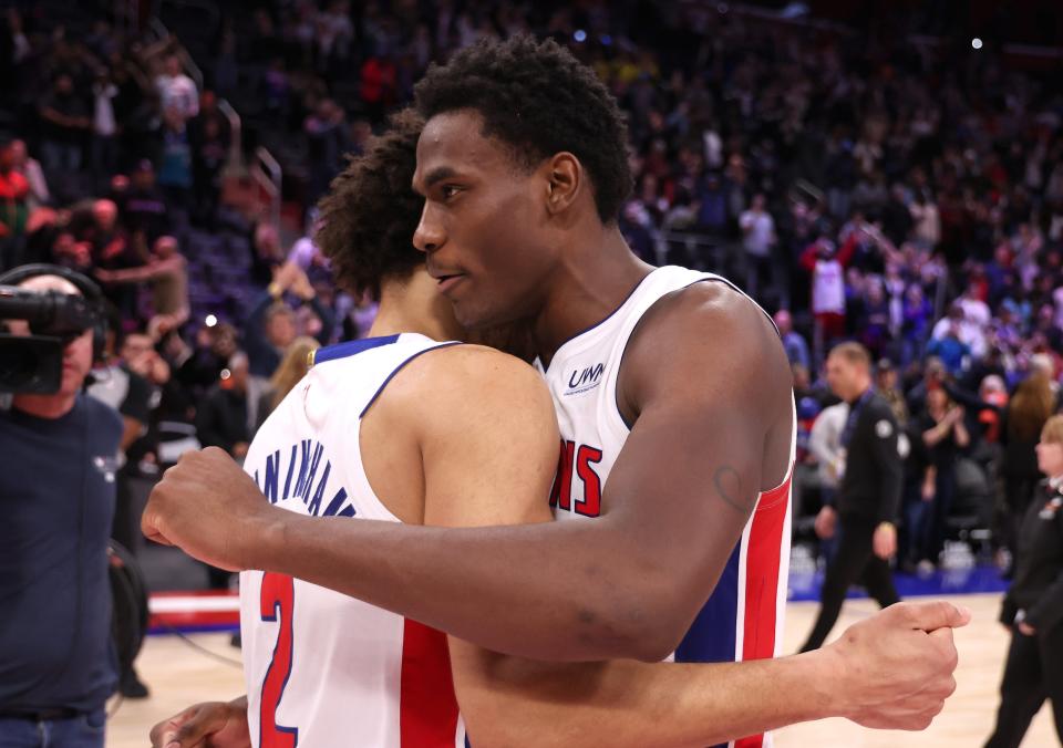 Pistons center Jalen Duren, right, and Cade Cunningham react after the 129-127 win over the Raptors on Saturday, Dec. 30, 2023, at Little Caesars Arena, to snap the Pistons' 28-game losing streak.