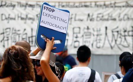 People attend a protest against proposed extradition bill of Hong Kong with China, in Berlin