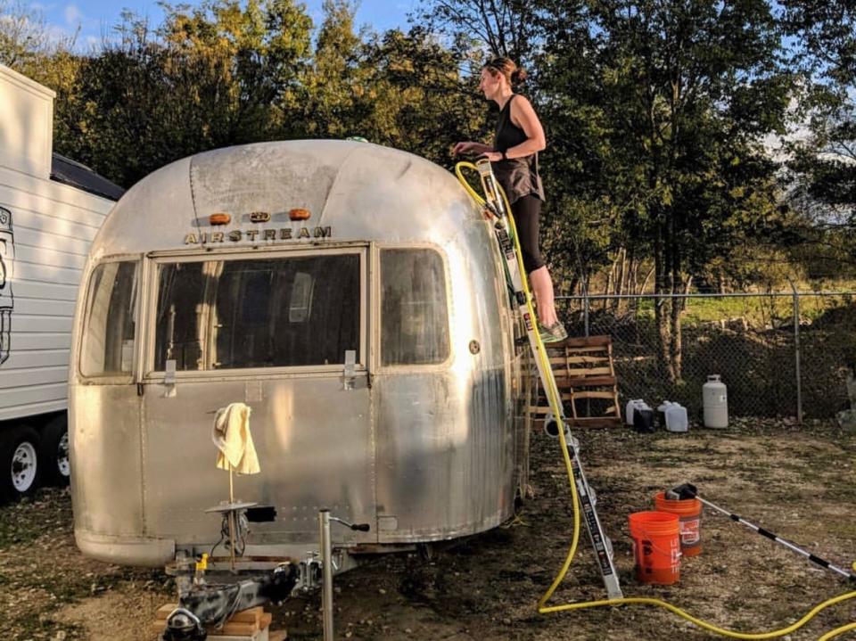 The couple worked on their Airstream at an outdoor parking lot.