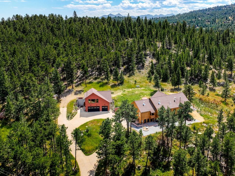 Soaring trees surround the 4,488-square-foot home, ensuring ample peace and privacy.