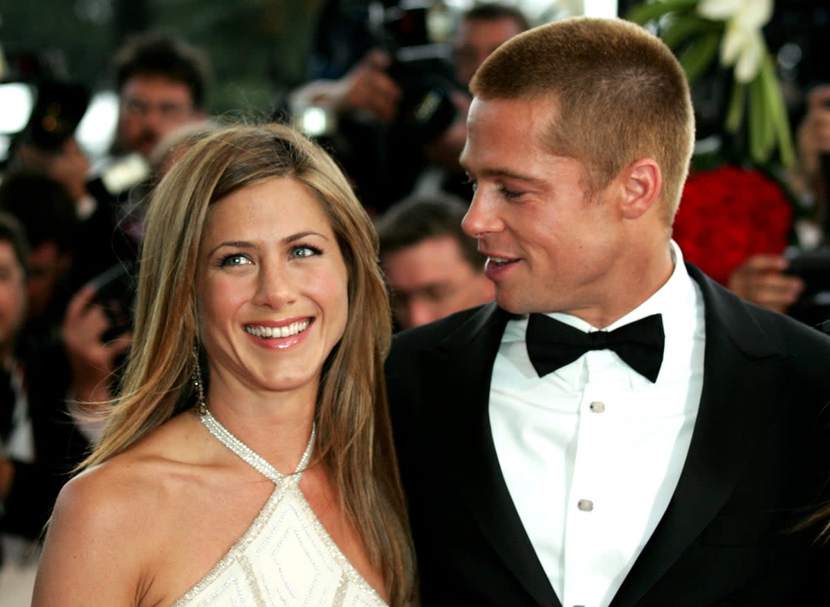 Jennifer Aniston and Brad Pitt arrive for the screening of Wolfgang Petersen’s ‘Troy’ at the 57th Cannes on 13 May 2004 (Reuters)