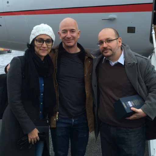 Jason Rezaian and his wife, Yeganeh, pose with Washington Post owner Jeff Bezos following his release from an Iranian prison