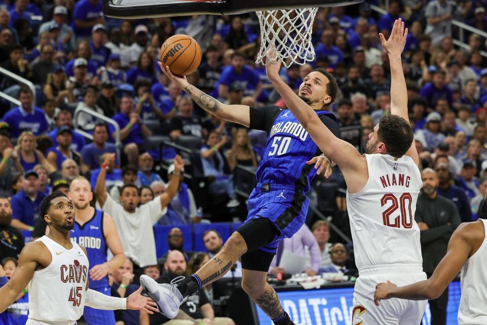 Orlando Magic guard Cole Anthony (50) goes to the basket against Cleveland Cavaliers forward Georges Niang (20) during the second half of Game 6.