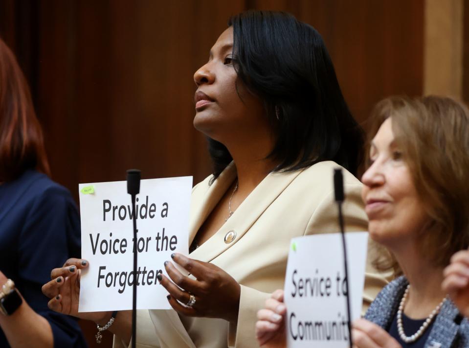 Rep. Sandra Hollins, D-Salt Lake City and Rep. Rosemary Lesser, D-Ogden, hold up signs showing their “why” for being state representatives on the first day of the general legislative session in the House chamber at the Capitol in Salt Lake City on Tuesday, Jan. 16, 2024. | Kristin Murphy, Deseret News