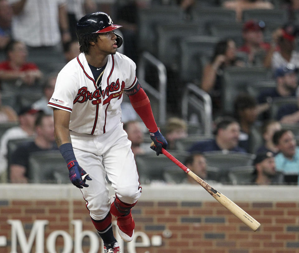 Atlanta Braves' Ronald Acuna Jr. watches his single against the Miami Marlins in the ninth inning of a baseball game Thursday, Aug. 22, 2019, in Atlanta. (AP Photo/Tami Chappell)