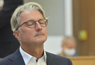 Rupert Stadler, the long-time head of Audi, who is accused of fraud, among other things, at the Munich Regional Court, Munich, Germany, Wednesday, Sept.30, 2020. Five years after the VW diesel scandal was uncovered, the first German criminal trial in this matter is now beginning. With the former Chairman of the Board of Management of Audi AG Stadler and the former member of the Board of Management of Porsche Hatz, two former leading Audi engineers are also accused. The trial is taking place under difficult conditions in a large hall at the Munich-Stadelheim prison on account of Corona. (Peter Kneffel/dpa via AP)