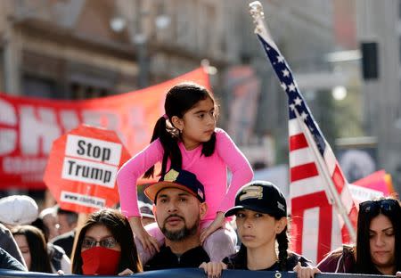 Protesters attend a march and rally against the United States President-elect Donald Trump in Los Angeles, California, U.S. December 18, 2016. REUTERS/Kevork Djansezian