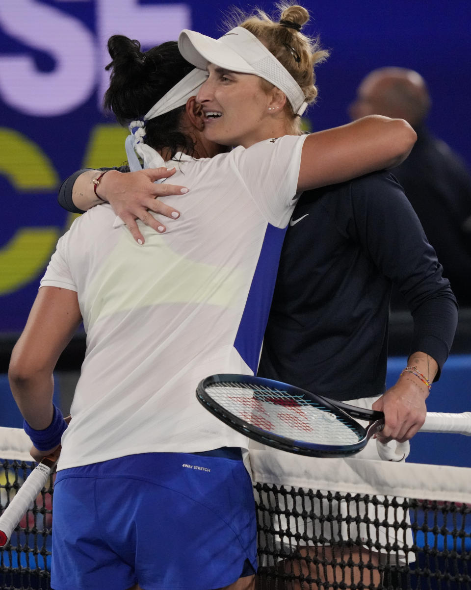 Marketa Vondrousova, right, of the Czech Republic is congratulated by Ons Jabeur of Tunisiain following their second round match at the Australian Open tennis championship in Melbourne, Australia, Friday, Jan. 20, 2023. (AP Photo/Dita Alangkara)