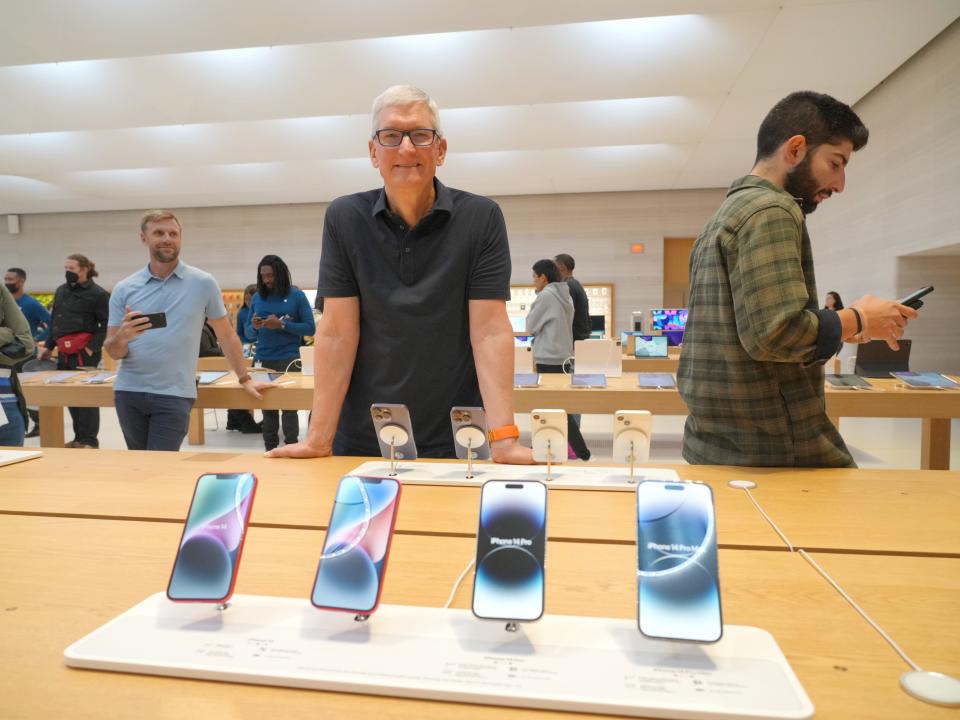 Tim Cook visits an Apple store in New York City on September 16.